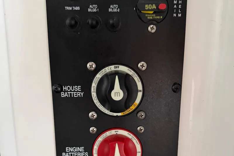 Slide: The Image of Control panel of a 2018 Sea Hunt Gamefish 30 Coffin Box boat, featuring battery switches. - 71
