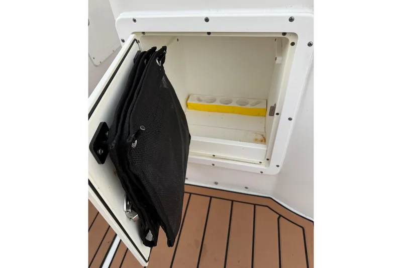 Slide: The Image of Open storage compartment on 2018 Sea Hunt Gamefish 30 Coffin Box boat. - 77