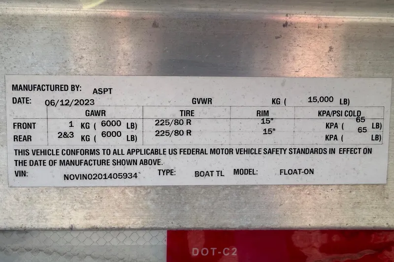 Slide: The Image of 2018 Sea Hunt Gamefish 30 Coffin Box label with vehicle specifications and safety standards. - 86