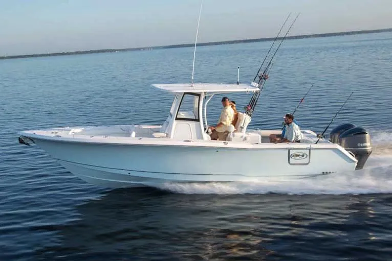 Slide: The Image of Manufacturer Provided Image: 2018 Sea Hunt Gamefish 30 Forward Seating boat cruising on calm water. - 87