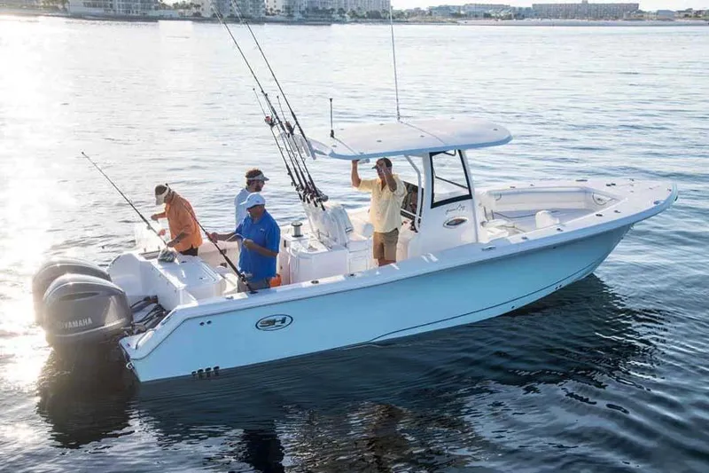 Slide: The Image of Manufacturer Provided Image: 2018 Sea Hunt Gamefish 30 boat with anglers fishing on calm water. - 88