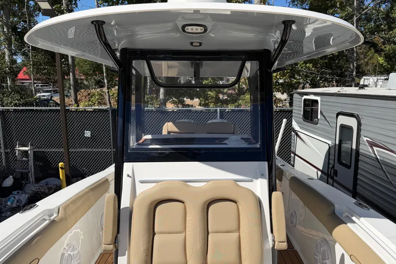 Slide: The Image of 2018 Sea Hunt Gamefish 30 Coffin Box boat interior with seating and console. - 9