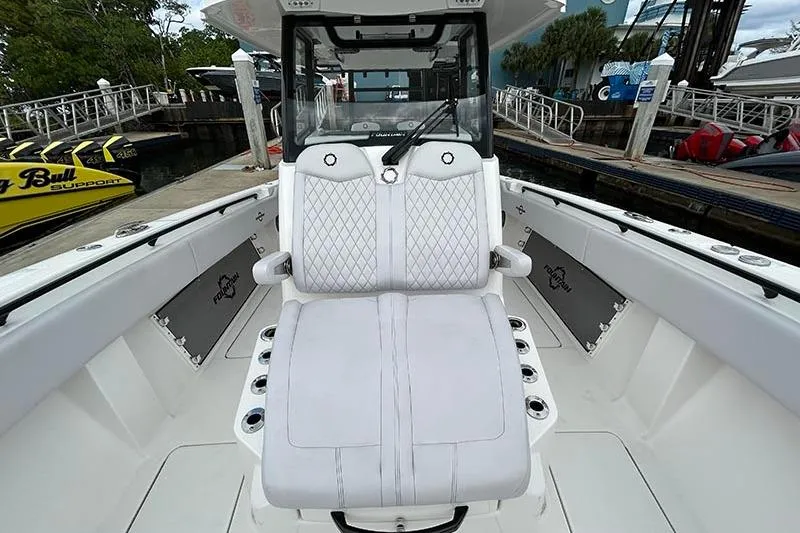 Slide: The Image of 2025 Fountain 38 Center Console boat with luxurious white seating and modern design. - 14