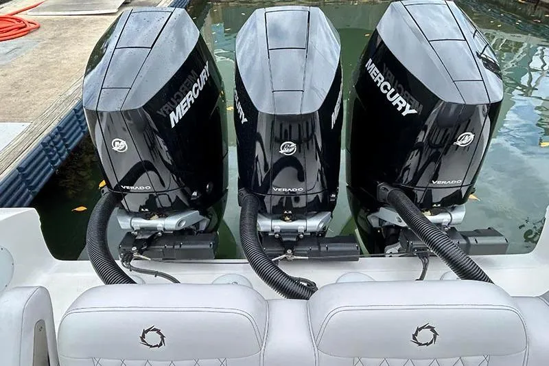 Slide: The Image of Triple Mercury Verado engines on a 2025 Fountain 38 Center Console boat. - 18