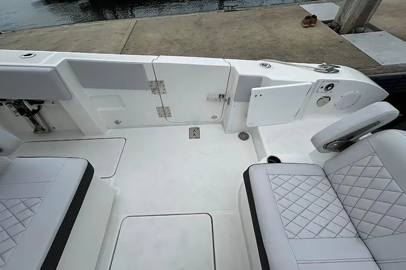 Slide: The Image of 2025 Fountain 38 Center Console boat interior with white seating and deck. - 20
