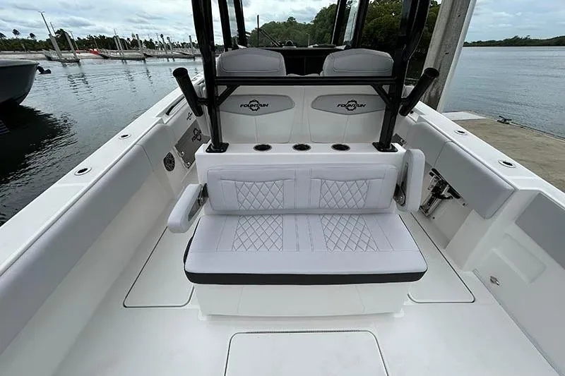 Slide: The Image of 2025 Fountain 38 Center Console boat interior with cushioned seating and sleek design. - 21