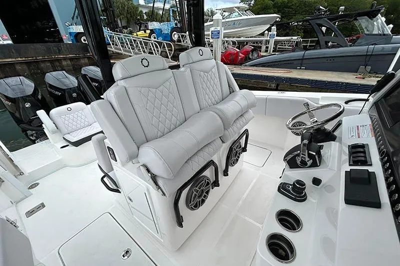 Slide: The Image of 2025 Fountain 38 Center Console boat interior with luxurious seating and modern controls. - 23