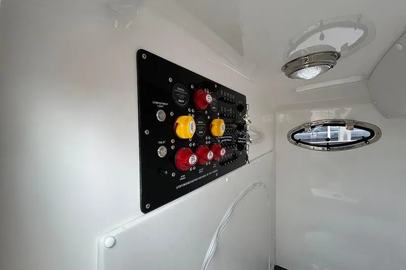 Slide: The Image of 2025 Fountain 38 Center Console control panel with switches and indicators. - 24