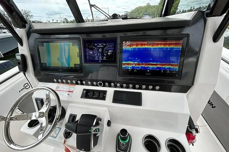 Slide: The Image of 2025 Fountain 38 Center Console dashboard with advanced navigation and control systems. - 7