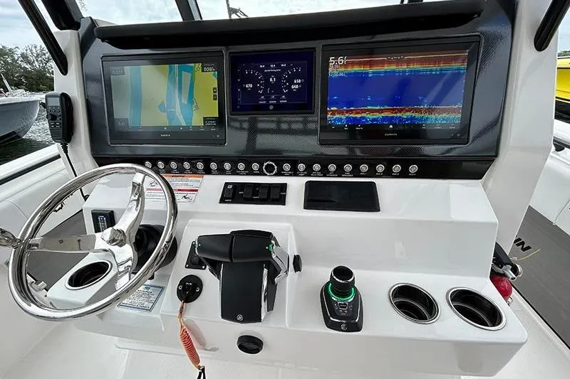 Slide: The Image of 2025 Fountain 38 Center Console dashboard with advanced navigation and control systems. - 8