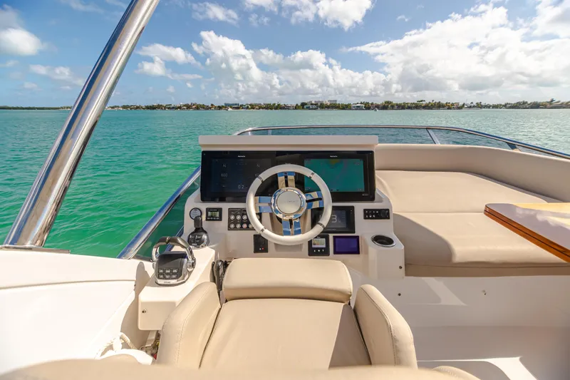 Slide: The Image of 2020 Azimut AZ 50-Fly yacht helm with luxurious seating and ocean view. - 10