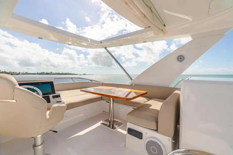 Slide: The Image of Luxurious 2020 Azimut AZ 50-Fly yacht interior with elegant seating and ocean view. - 13