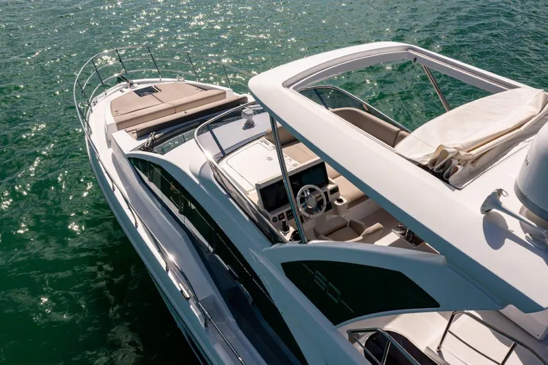 Slide: The Image of Azimut AZ 50-Fly 2020 yacht cruising on clear blue water, top view. - 2