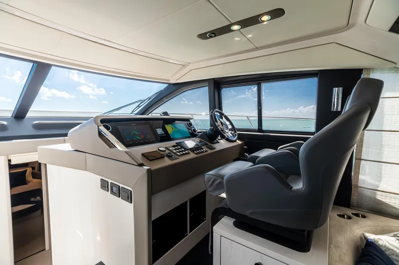 Slide: The Image of 2020 Azimut AZ 50-Fly yacht helm with modern controls and panoramic windows. - 26