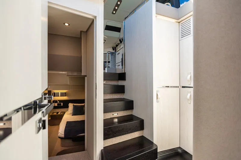 Slide: The Image of Interior of 2020 Azimut AZ 50-Fly yacht featuring modern staircase and cozy cabin. - 27