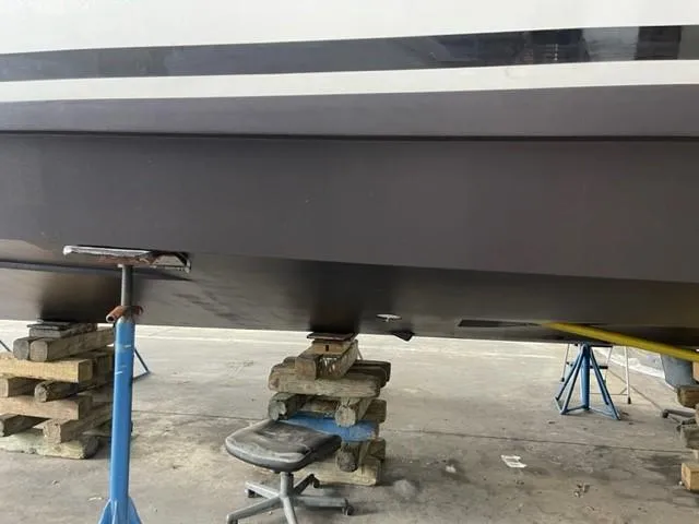 Slide: The Image of 2020 Azimut AZ 50-Fly yacht hull on supports in a maintenance area. - 44