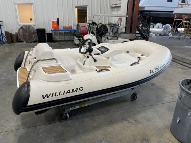 Slide: The Image of Inflatable Williams boat in a workshop, Azimut AZ 50-Fly, 2020 model nearby. - 45
