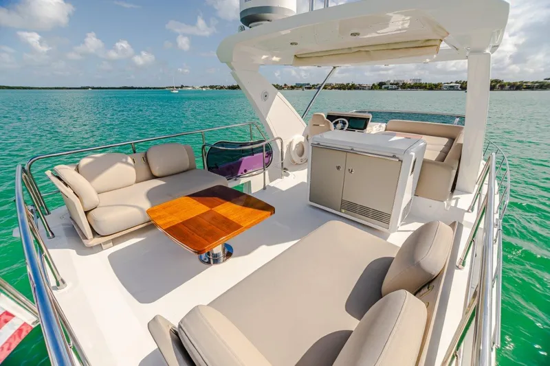 Slide: The Image of Luxurious 2020 Azimut AZ 50-Fly yacht deck with elegant seating and ocean view. - 7