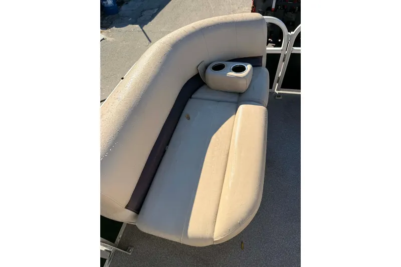 Slide: The Image of 2017 Sun Tracker Party Barge 22 DLX beige seating with cup holders. - 2