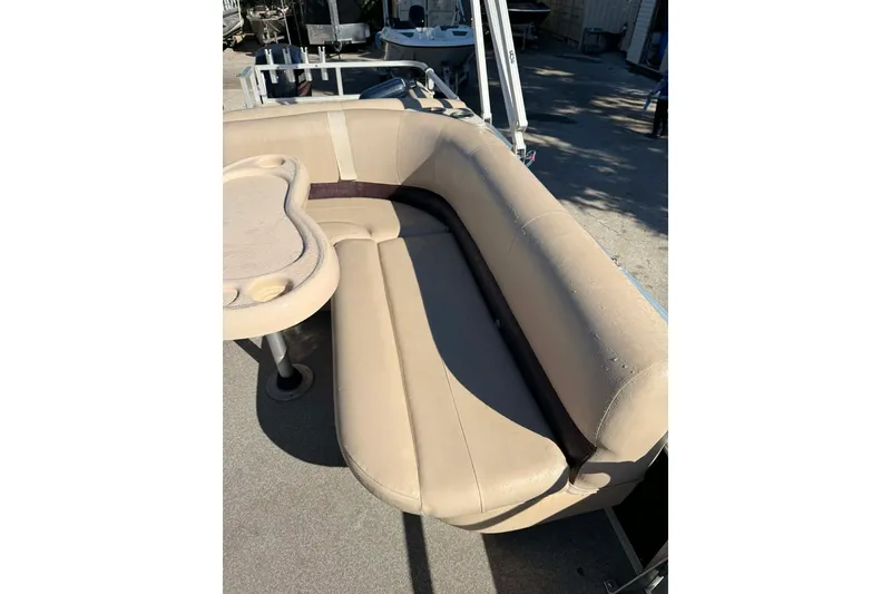 Slide: The Image of 2017 Sun Tracker Party Barge 22 DLX with beige seating and table. - 6