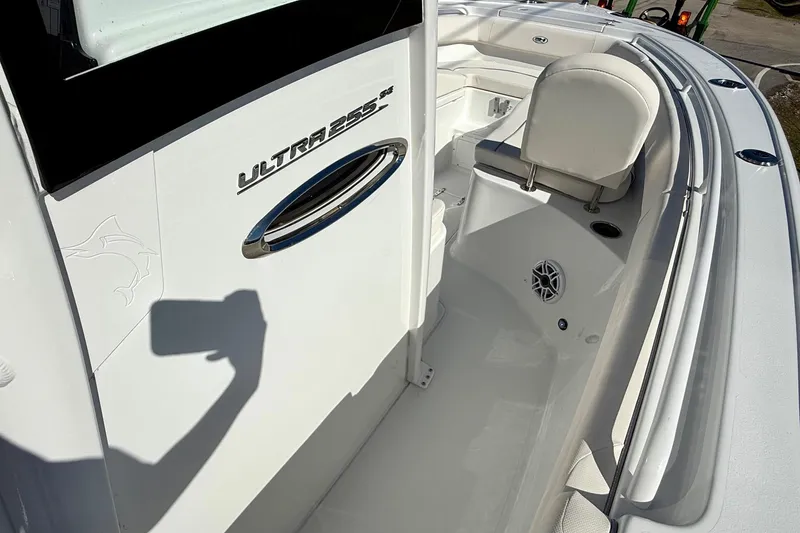 Slide: The Image of 2026 Sea Hunt Ultra 255 SE boat interior with seating and speaker detail. - 15
