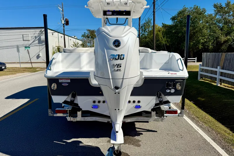 Slide: The Image of 2026 Sea Hunt Ultra 255 SE boat with powerful outboard motor on a trailer. - 3