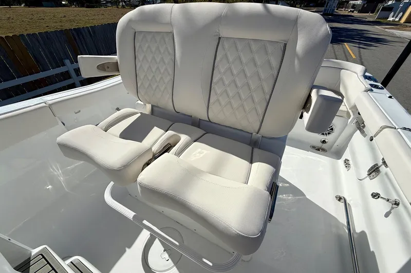 Slide: The Image of Luxurious seating on 2026 Sea Hunt Ultra 255 SE boat, featuring diamond-stitched upholstery. - 9
