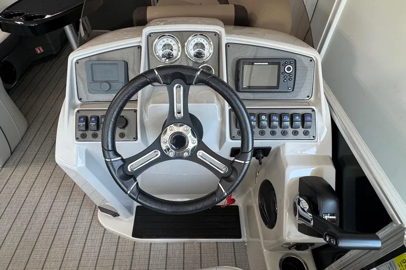 Slide: The Image of Steering console of 2026 Starcraft EX 20 Q DH boat with modern controls and gauges. - 5