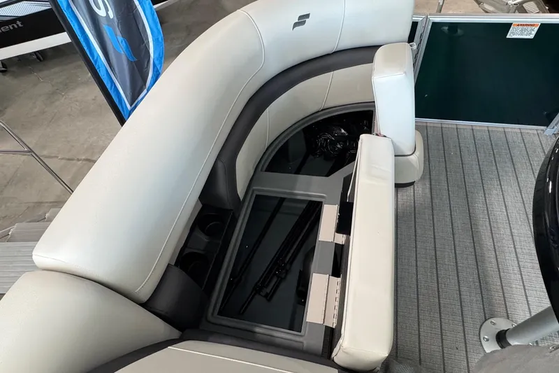 Slide: The Image of 2026 Starcraft EX 20 Q DH boat interior with cushioned seating and storage compartment. - 14