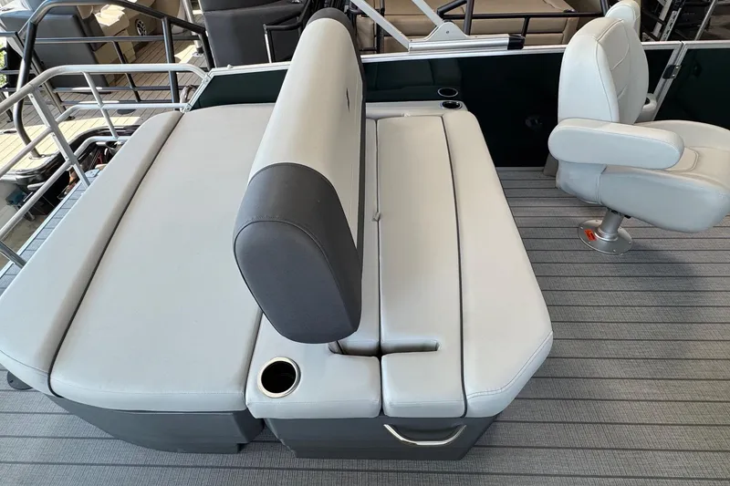 Slide: The Image of 2026 Starcraft EX 20 Q DH boat interior with gray seating and cup holder. - 10