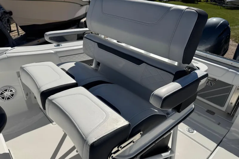 Slide: The Image of 2021 Blackfin 252 CC boat seating with cushioned armrests and sleek design. - 20