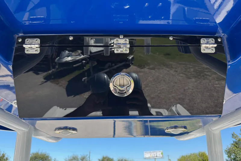 Slide: The Image of 2021 Blackfin 252 CC boat console with blue finish and stainless steel hinges. - 22