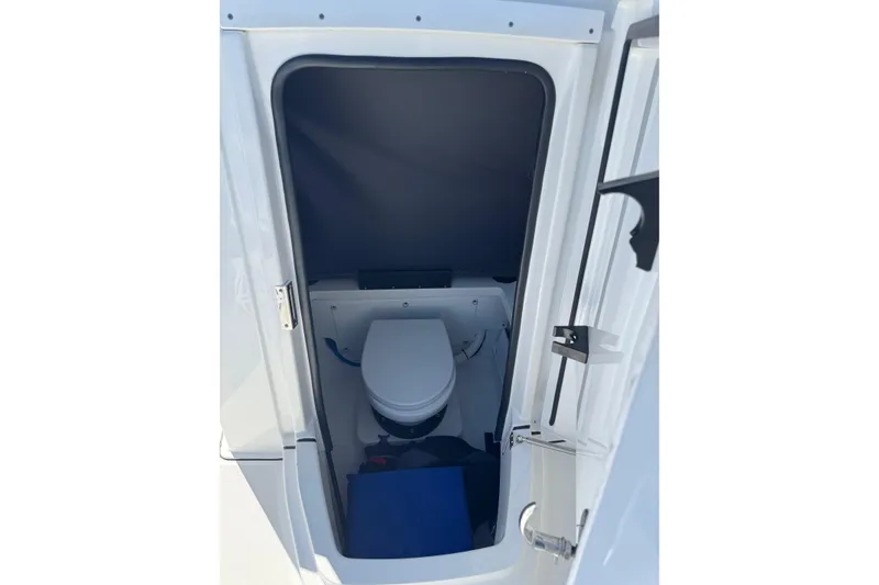 Slide: The Image of 2021 Blackfin 252 CC boat interior with compact marine toilet. - 26