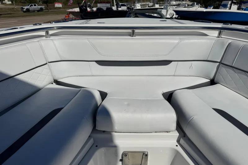 Slide: The Image of 2021 Blackfin 252 CC boat interior with white cushioned seating. - 32