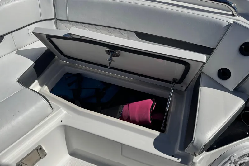 Slide: The Image of Open storage compartment on 2021 Blackfin 252 CC boat with seating. - 34