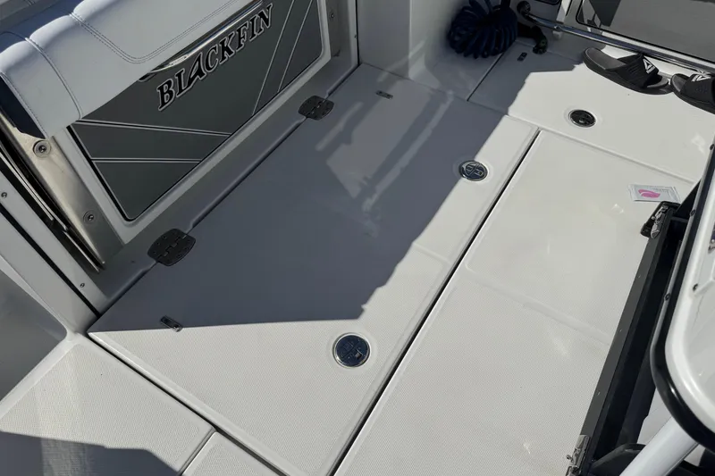 Slide: The Image of 2021 Blackfin 252 CC boat deck with storage compartments and seating. - 38