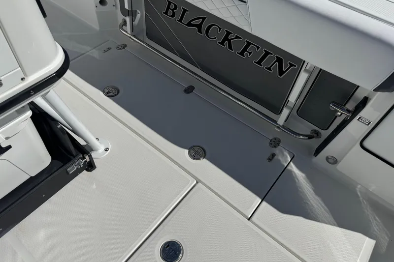 Slide: The Image of 2021 Blackfin 252 CC boat deck with sleek design and storage compartments. - 39