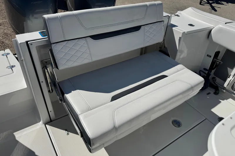 Slide: The Image of 2021 Blackfin 252 CC boat seat with white upholstery and diamond stitching. - 6
