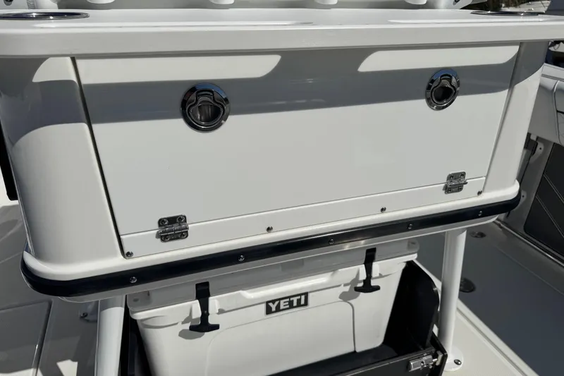 Slide: The Image of 2021 Blackfin 252 CC boat with Yeti cooler storage compartment. - 8