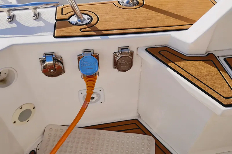 Slide: The Image of Canoe Cove 50 Pilothouse Motor Yacht 2002 with power connection and teak deck details. - 13