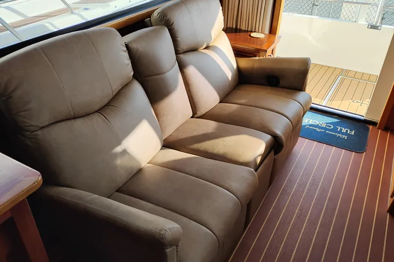 Slide: The Image of Luxurious interior of 2002 Canoe Cove 50 Pilothouse Motor Yacht with plush seating. - 17