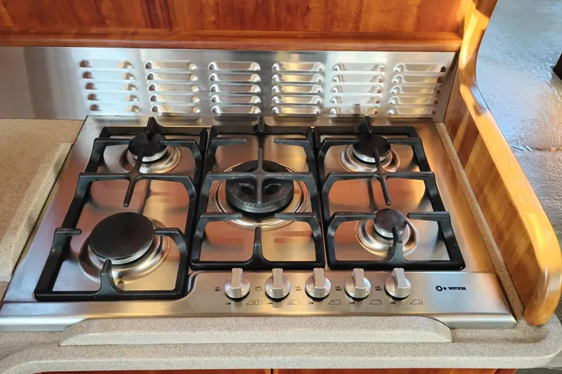 Slide: The Image of Stainless steel gas stove in 2002 Canoe Cove 50 Pilothouse Motor Yacht kitchen. - 25