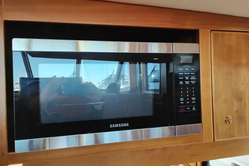 Slide: The Image of Samsung microwave inside 2002 Canoe Cove 50 Pilothouse Motor Yacht kitchen. - 27