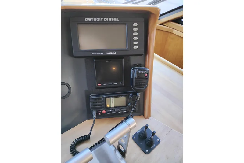 Slide: The Image of Control panel of 2002 Canoe Cove 50 Pilothouse Motor Yacht with electronic navigation equipment. - 37