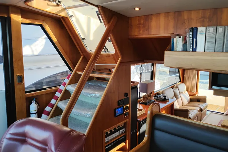 Slide: The Image of Luxurious interior of 2002 Canoe Cove 50 Pilothouse Motor Yacht with wooden accents and comfortable seating. - 43