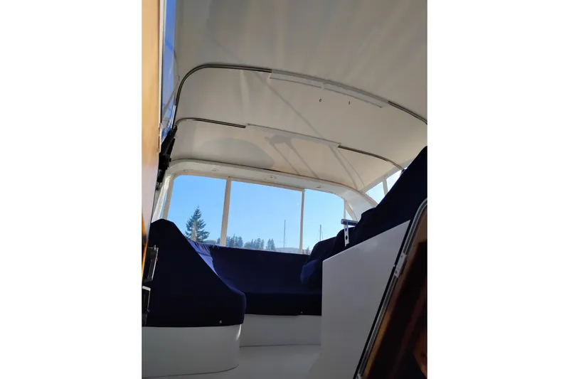 Slide: The Image of Interior view of 2002 Canoe Cove 50 Pilothouse Motor Yacht with blue seating. - 46
