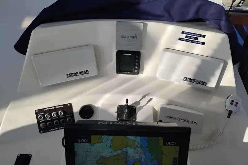 Slide: The Image of Control panel of a 2002 Canoe Cove 50 Pilothouse Motor Yacht with navigation equipment. - 47