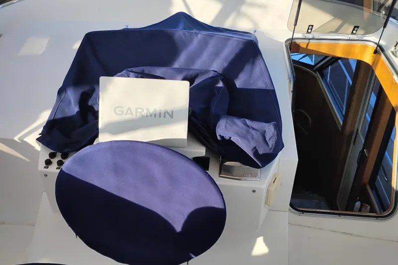 Slide: The Image of Canoe Cove 50 Pilothouse Motor Yacht helm with Garmin navigation, 2002 model. - 50