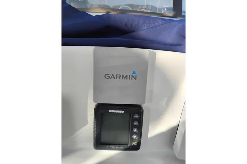Slide: The Image of Garmin and Humminbird devices on 2002 Canoe Cove 50 Pilothouse Motor Yacht dashboard. - 51