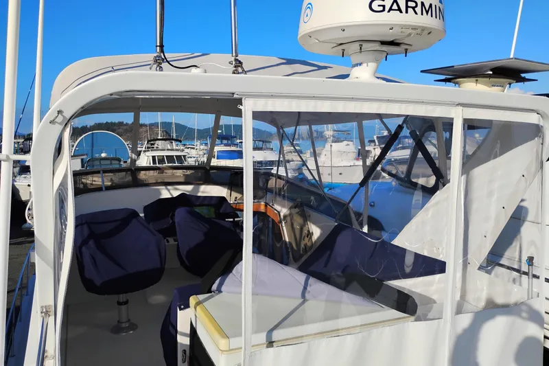 Slide: The Image of 2002 Canoe Cove 50 Pilothouse Motor Yacht with Garmin radar, docked in a marina. - 54